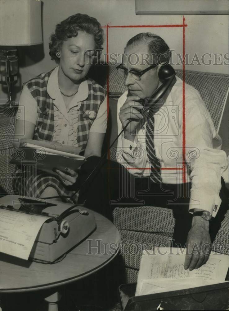 Press Photo Lieutenant Governor Albert Boutwell and Woman Review Papers - Historic Images