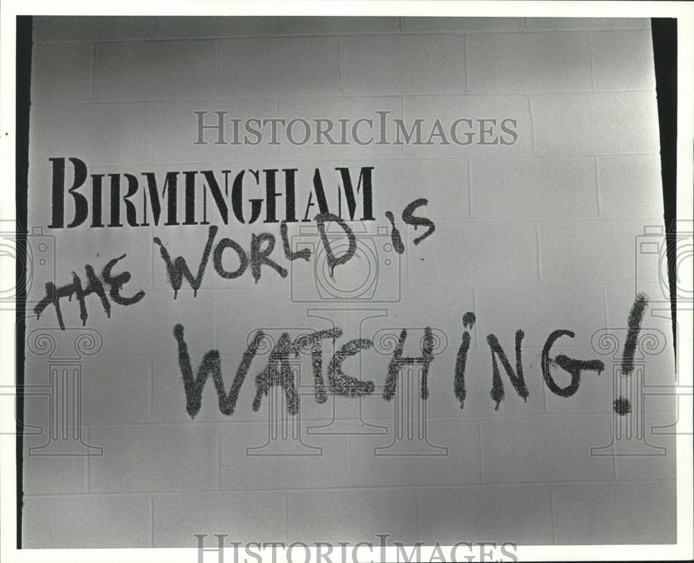 1992 Press Photo Sign saying "The World is Watching!" - Civil Rights Museum - Historic Images