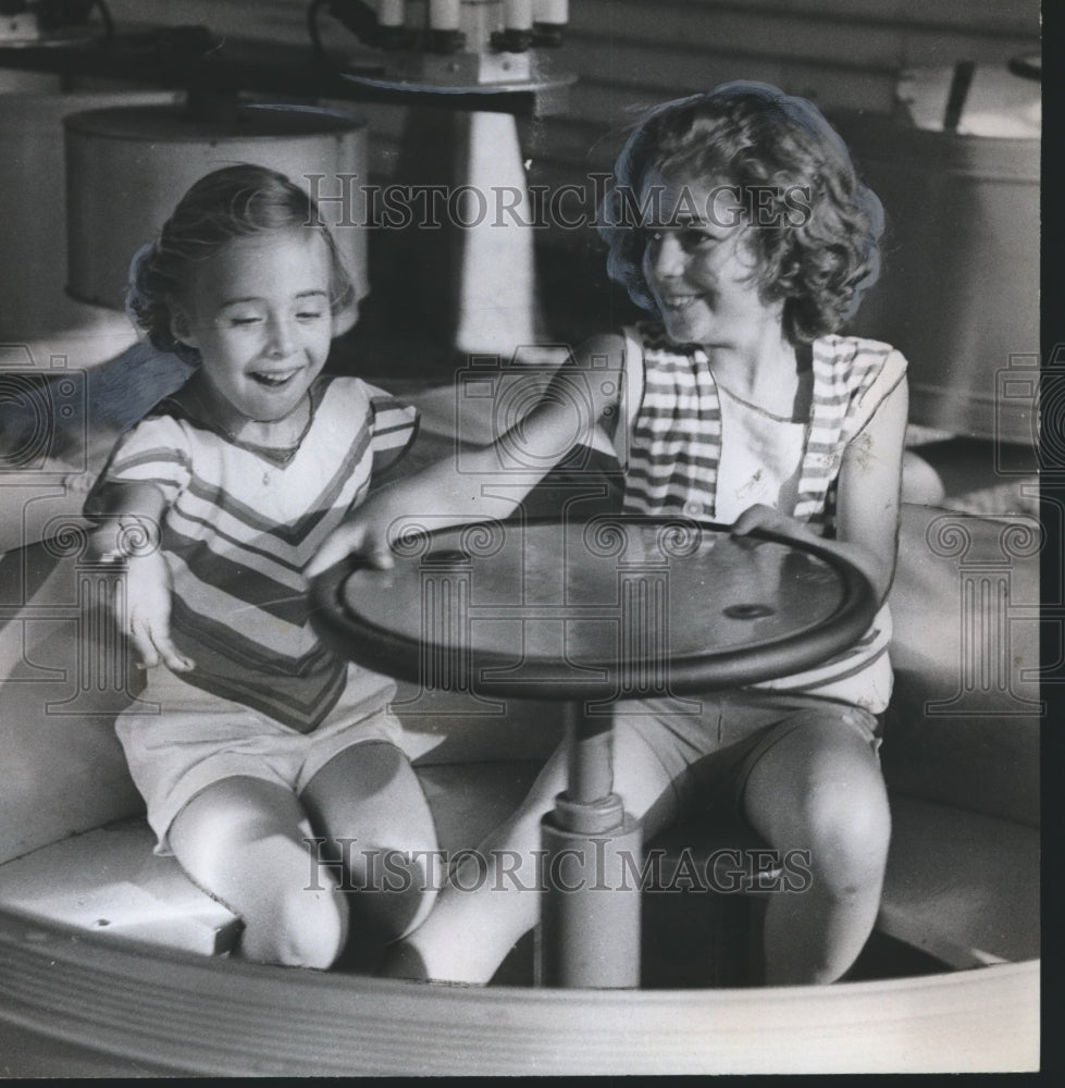 1961 Two Children on Tub Ride at Kiddieland in Birmingham, Alabama - Historic Images