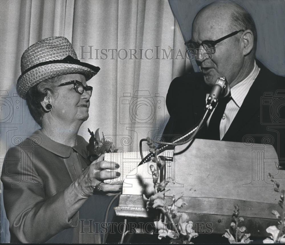 1968, Mrs. R. K. Coffee News Director accepts award from Pete Mathews - Historic Images