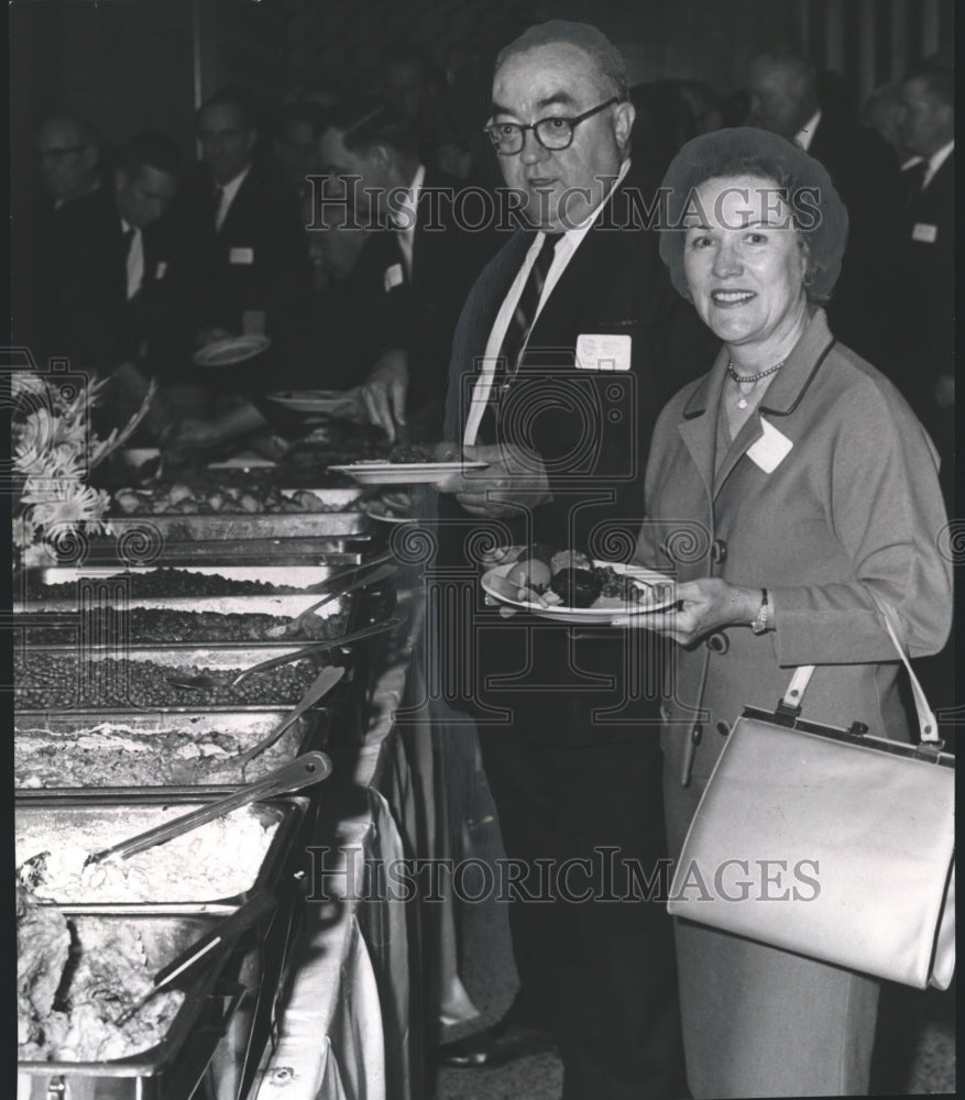 Mr. and Mrs. Tine Davis at luncheon saluting state products - Historic Images