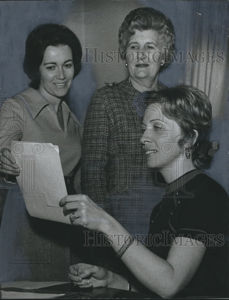 1972, Mrs. Sullivan, Mrs. Deramus and Mrs. Reed look over materials - Historic Images