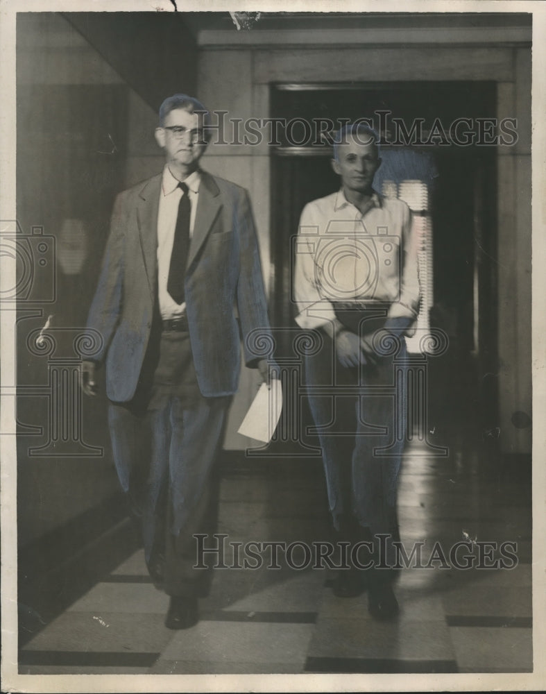 1957, Charles Edwards escorted by Bailiff James R. McAdory Sr. - Historic Images