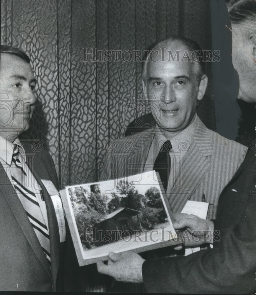 1970, Politician Jack Edwards and others look at old photo - Historic Images