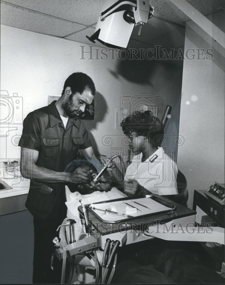 1981 Doctor Frank Bell II, and Wanda Nunn check for cavities Dentist - Historic Images