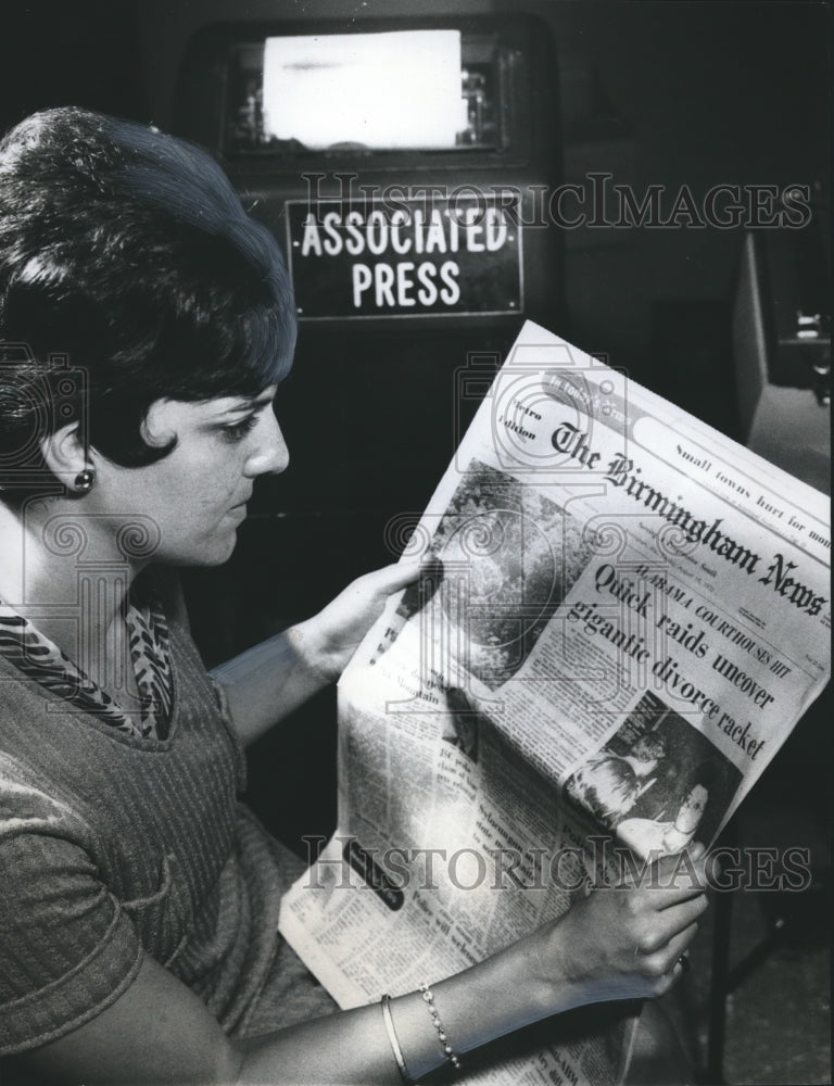 1970, Mrs. Christine Dare reads The Birmingham News about Divorce - Historic Images