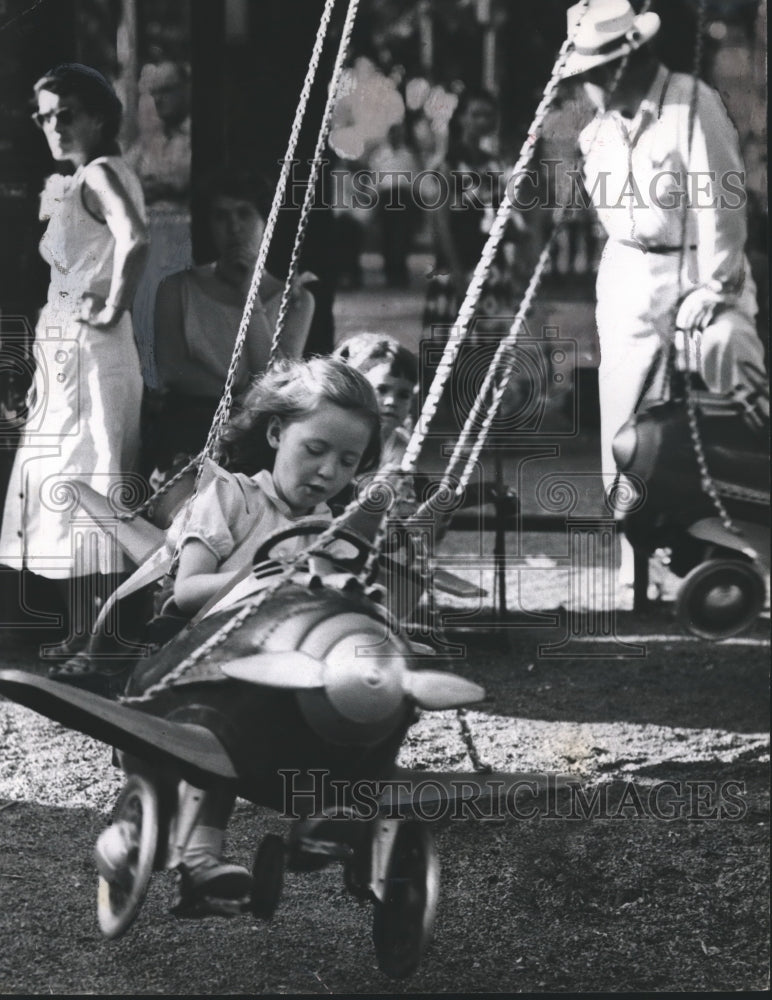 1954 Press Photo Little Girl Riding on Kiddieland Plane Ride at Fair Park-Historic Images