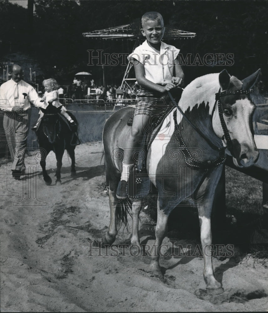 1961, Young Boy Rides Pony at Kiddieland, Fair Park, Birmingham - Historic Images