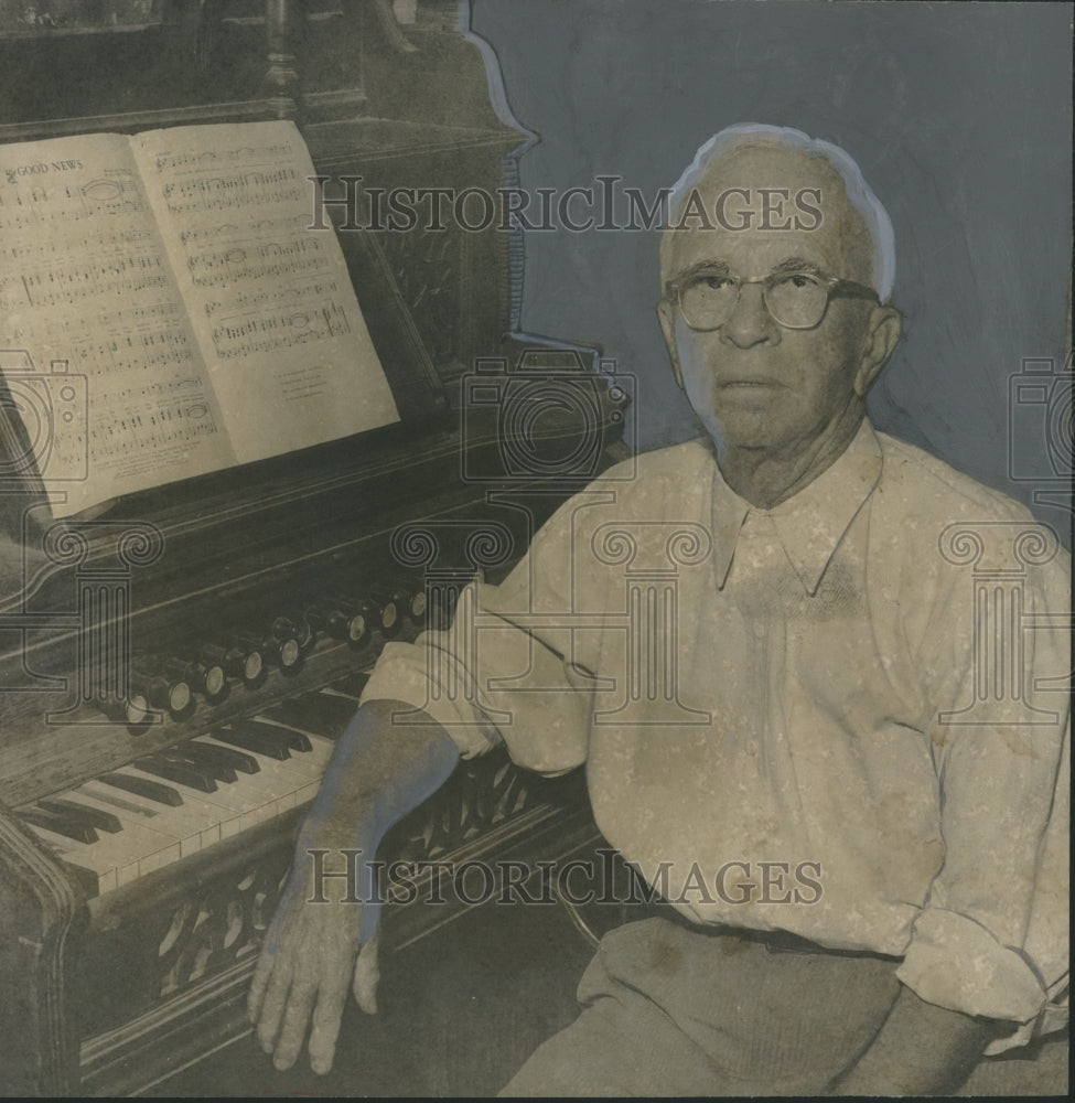 1957, Composer Oliver Cooper of Cullman, Alabama sits at piano - Historic Images