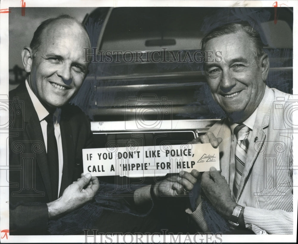 1970, John Corbin and Si Wages hold bumper sticker - abno01559 - Historic Images