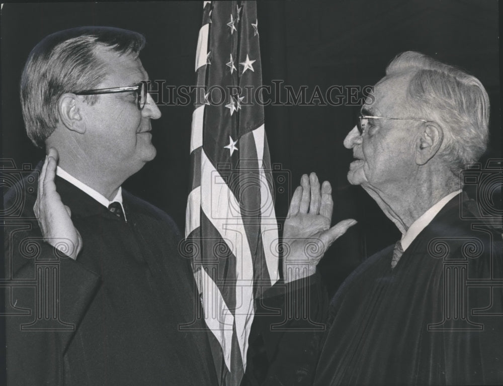 1975 Eric Embry sworn in as state judge by father Judge Frank Embry - Historic Images