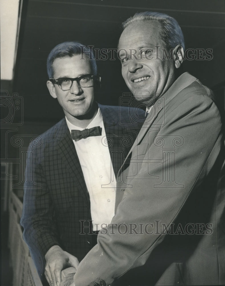 1966, Dr. John Dunbar of Birmingham talks with Dr. Cavalli of Italy - Historic Images