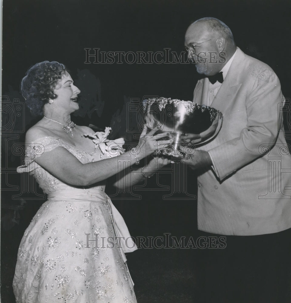 1955 Mrs. Morris Bush receives gift from Mervyn Sterne at Party - Historic Images