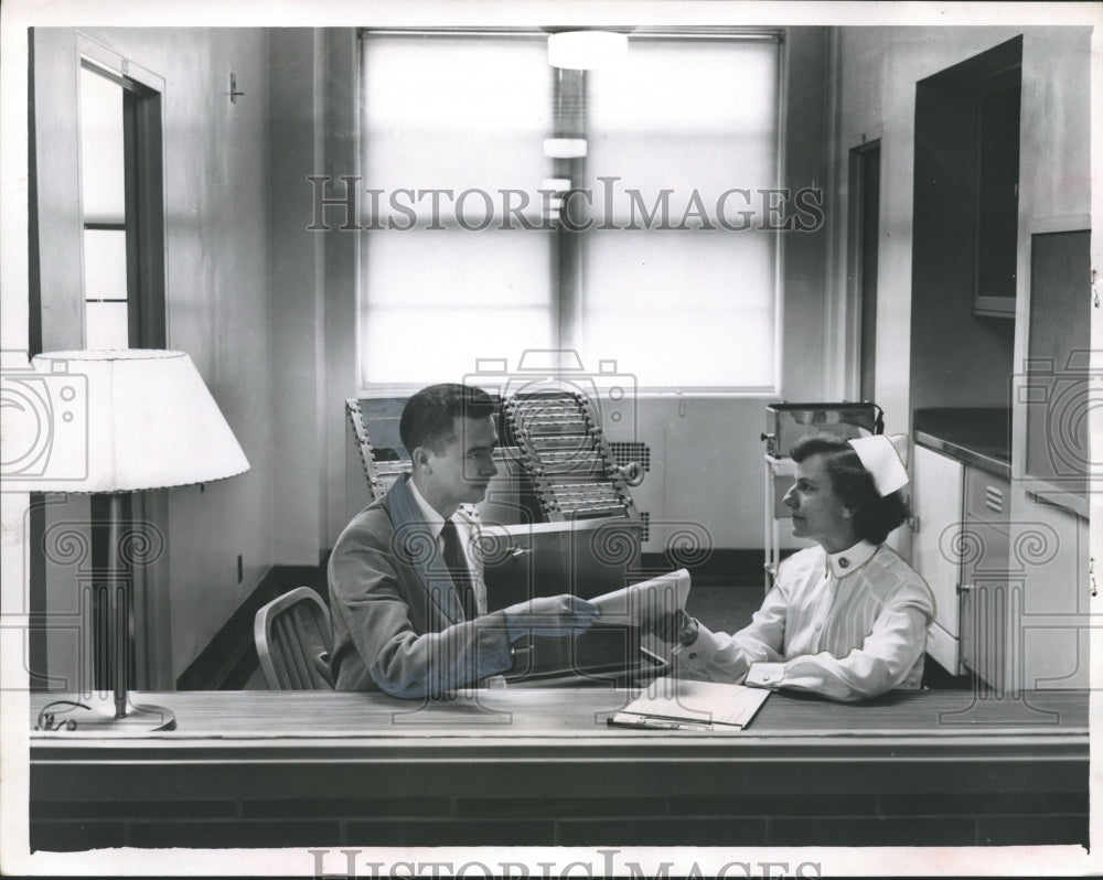 1953, Patient talks with nurse at Birmingham Veterans Hospital - Historic Images