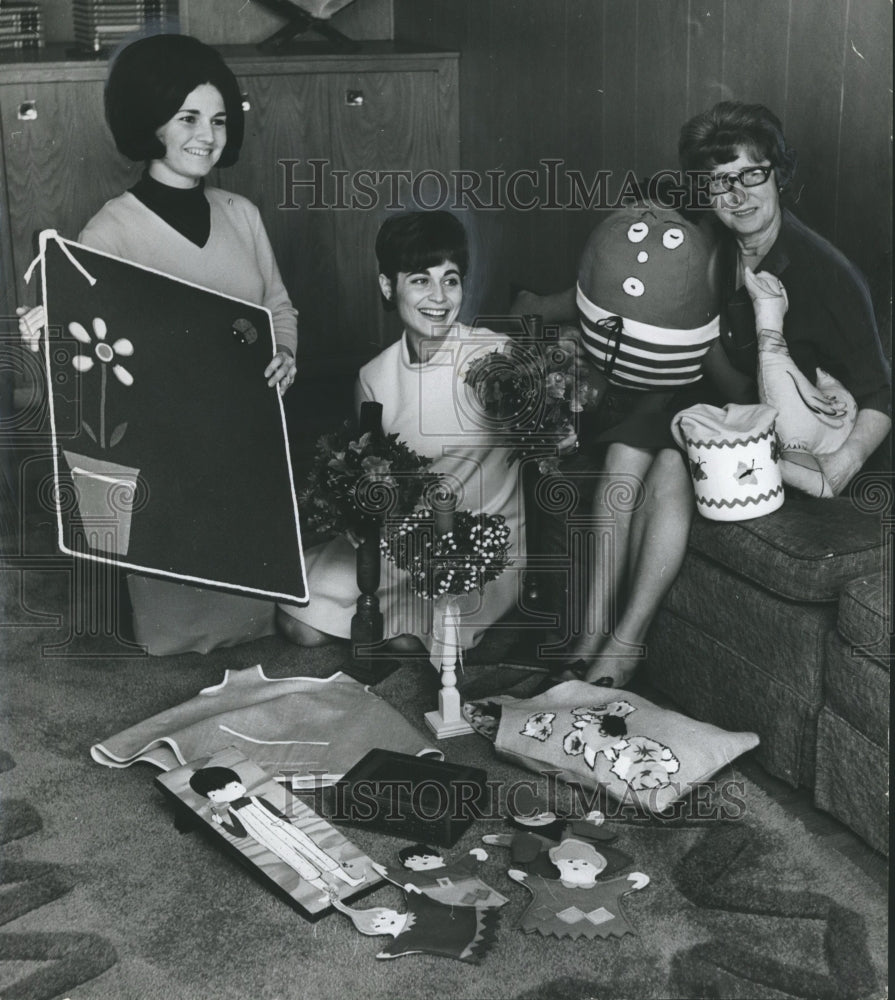 1966, Mrs. Harvey Gotlieb and others hold bazaar items - abno03831 - Historic Images