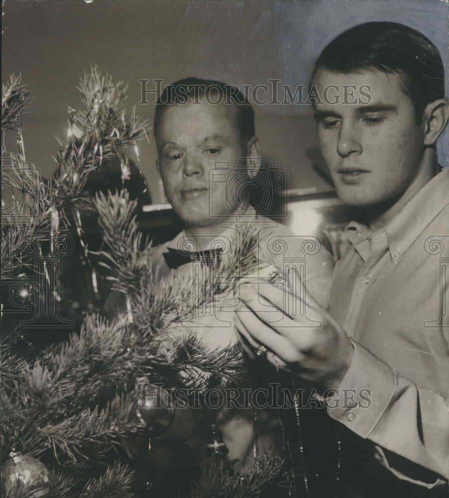 1968, Henry &quot;Red&quot; E. Erwin and son, Hank, Decorate Christmas Tree - Historic Images