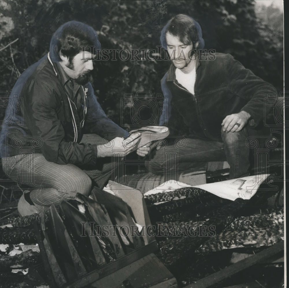 1970, Ron Yount and Larry Orr examine fire damage in Birmingham - Historic Images