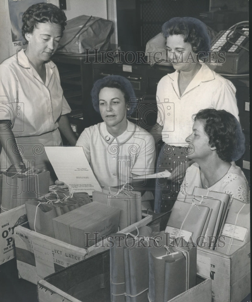 1961, Women leaders in United Appeal in office looking at documents - Historic Images