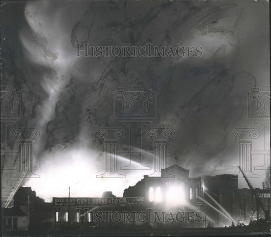 1957, Birmingham refinery on fire as firefighters spray hoses - Historic Images