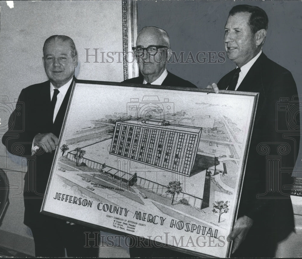 1968 Officials with drawing of Jefferson County Mercy Hospital - Historic Images