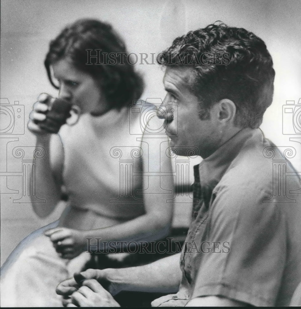 1975, Mr. and Mrs. McDaniel answer questions at Hoover police station - Historic Images