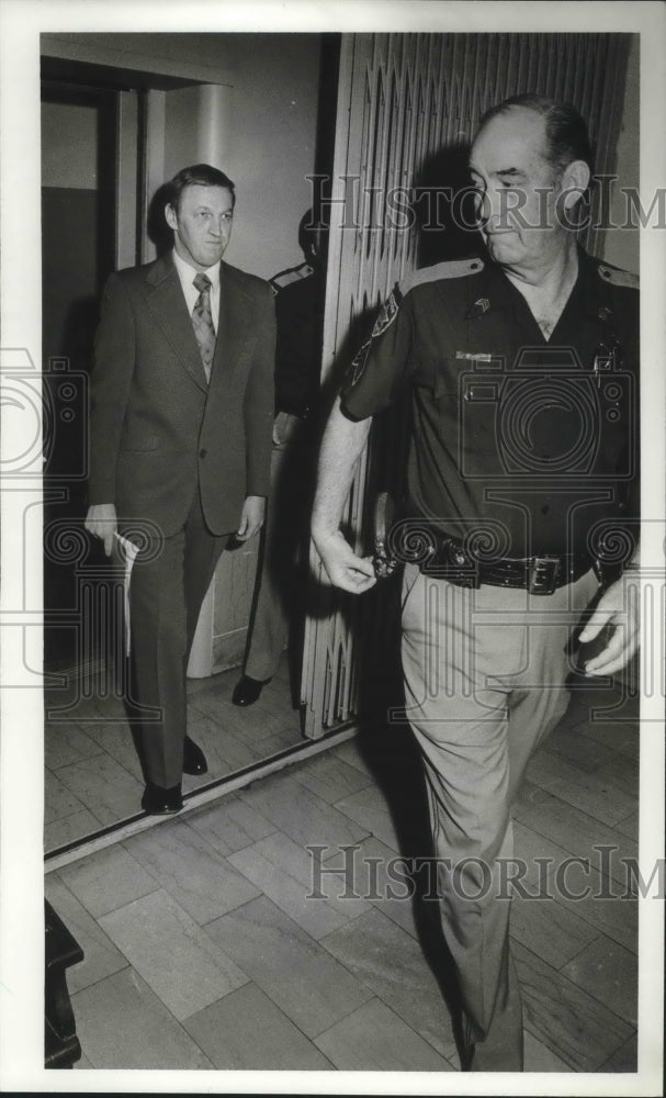 1982, Thomas Fullman escorted by Joe Woods in court - abno04961 - Historic Images