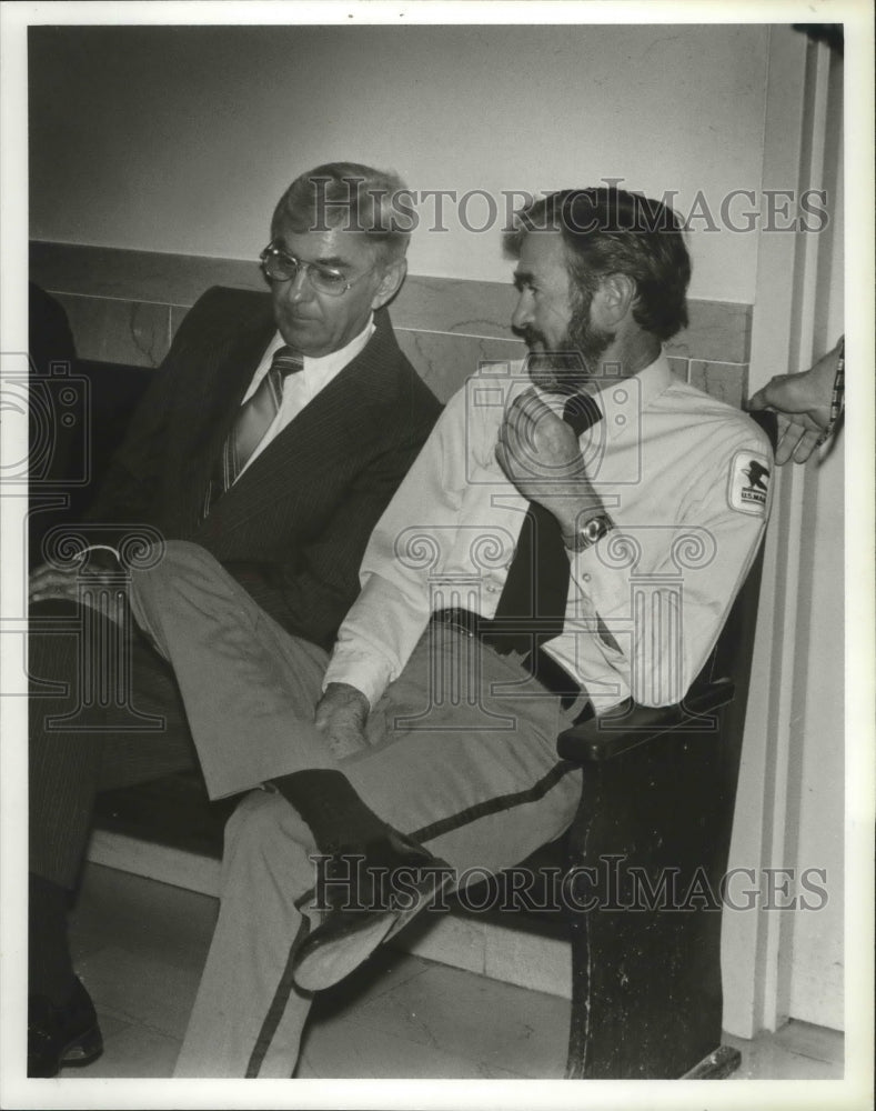 1979 Men Seated on Bench Talk - Historic Images