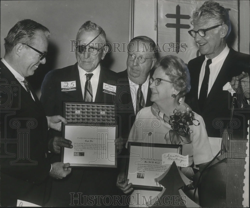 1969, Guest speaker admires Tuberculosis Association awards - Historic Images