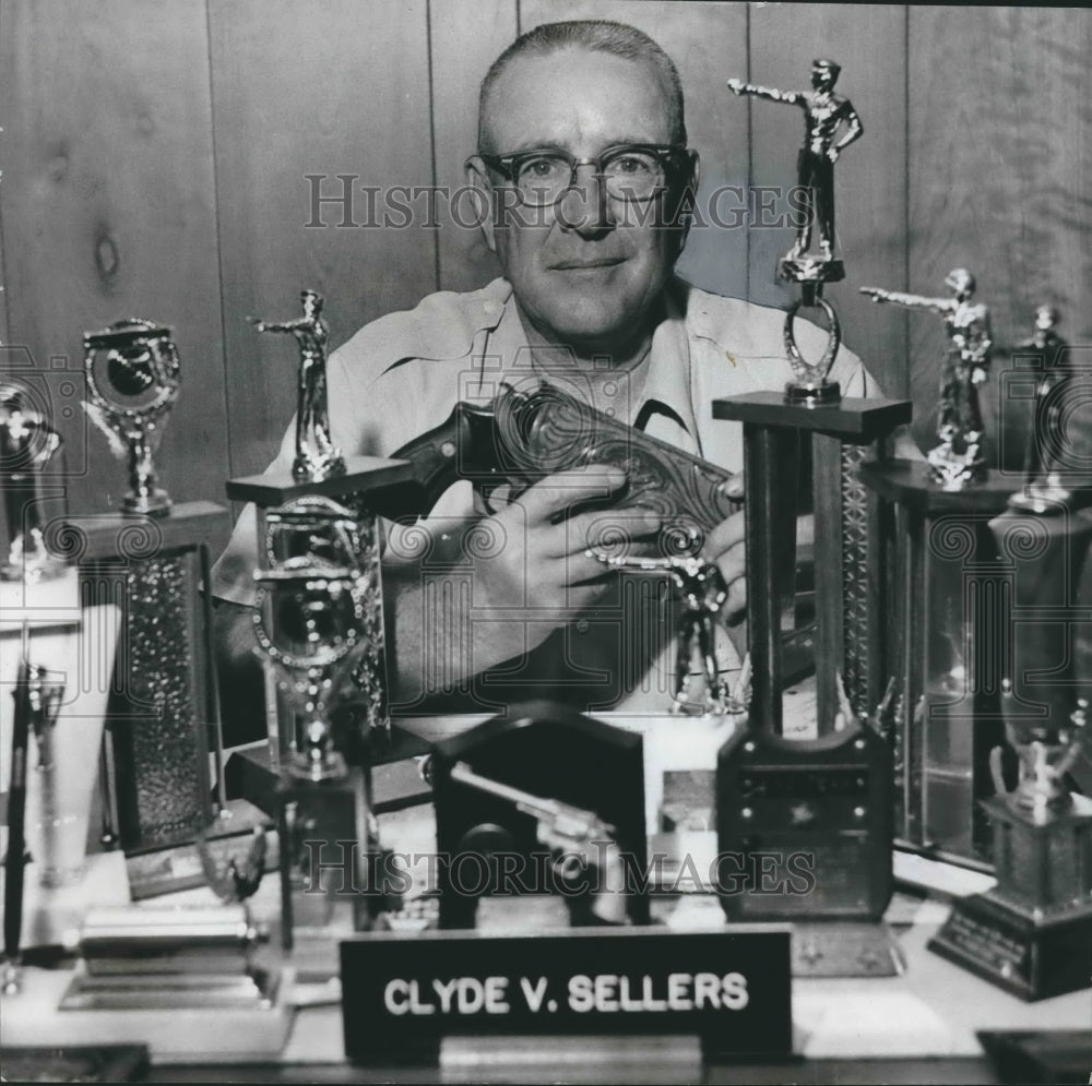 1966, Tarrant, Alabama police chief Clyde V. Sellers with trophies - Historic Images