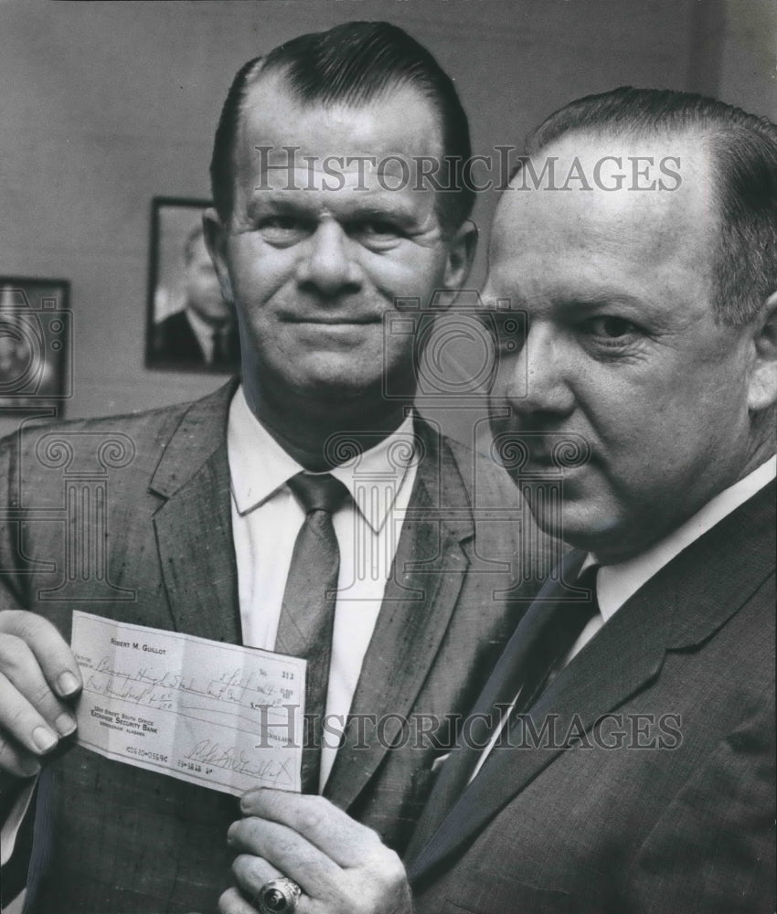 1964 Press Photo Robert Guillot buys Berry Stadium certificates from Ed Lindley - Historic Images