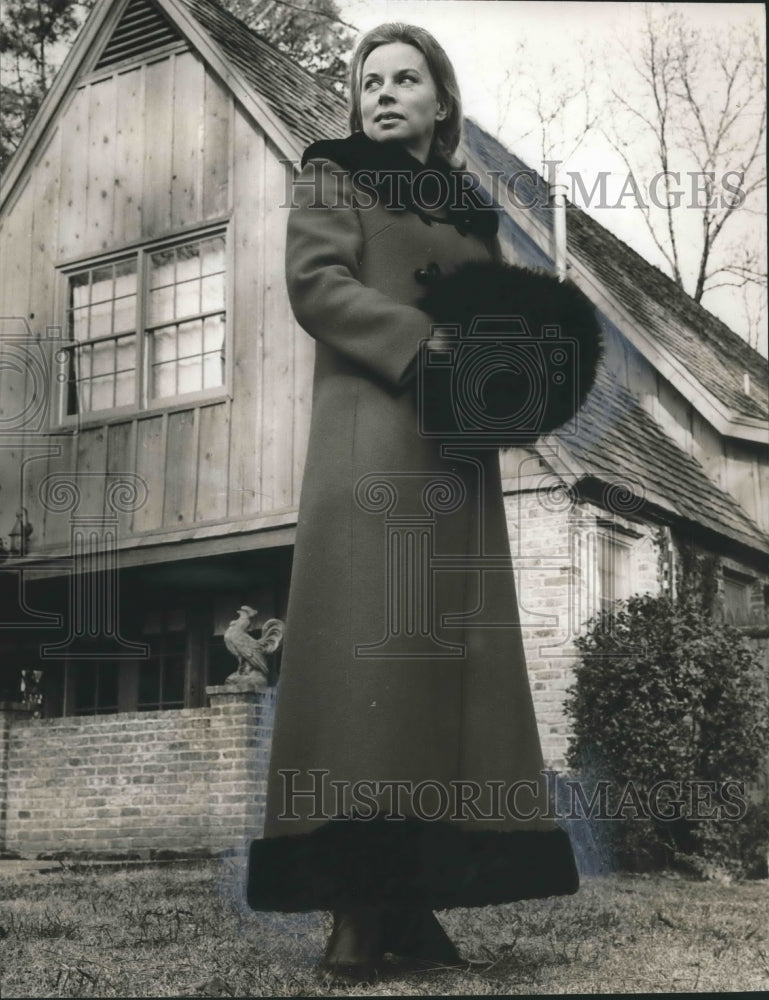 Mrs. Josh R. Oden Jr., of Scribblers enjoying long fur lined coat - Historic Images