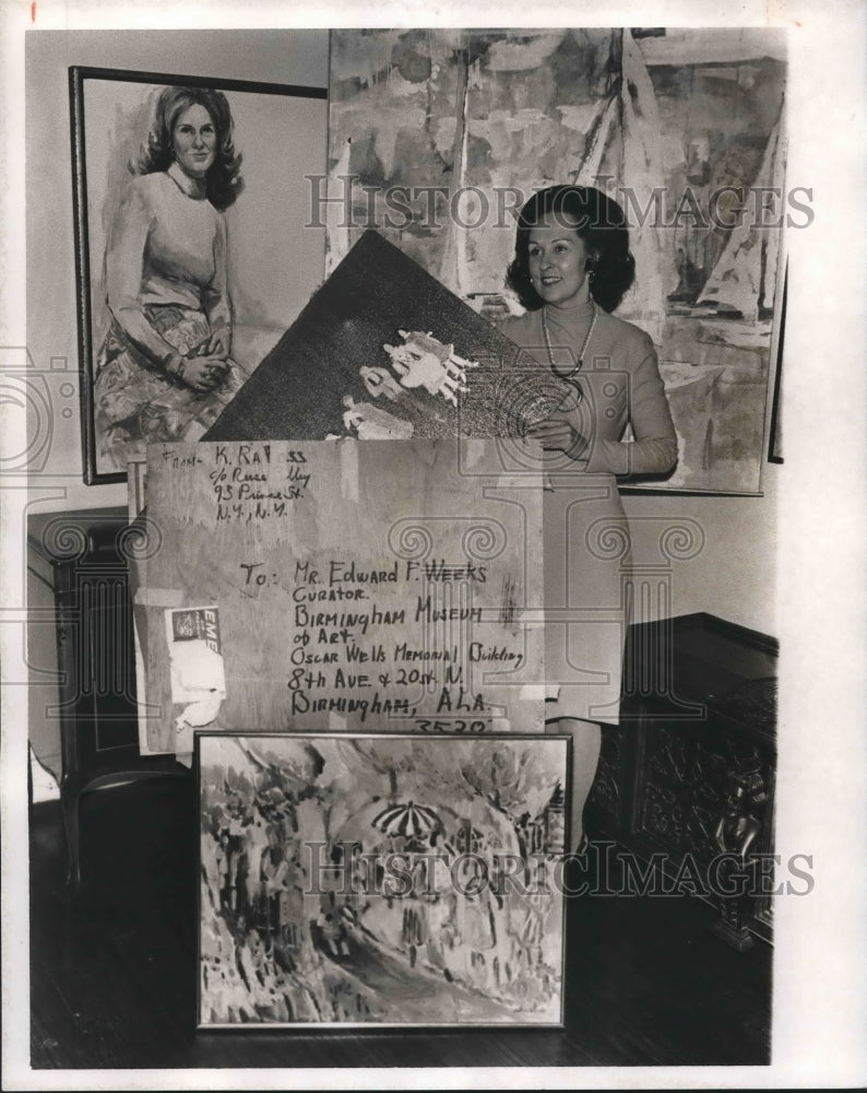 1975, Mrs. Donald Pritchard shows works of art for Museum Ball - Historic Images