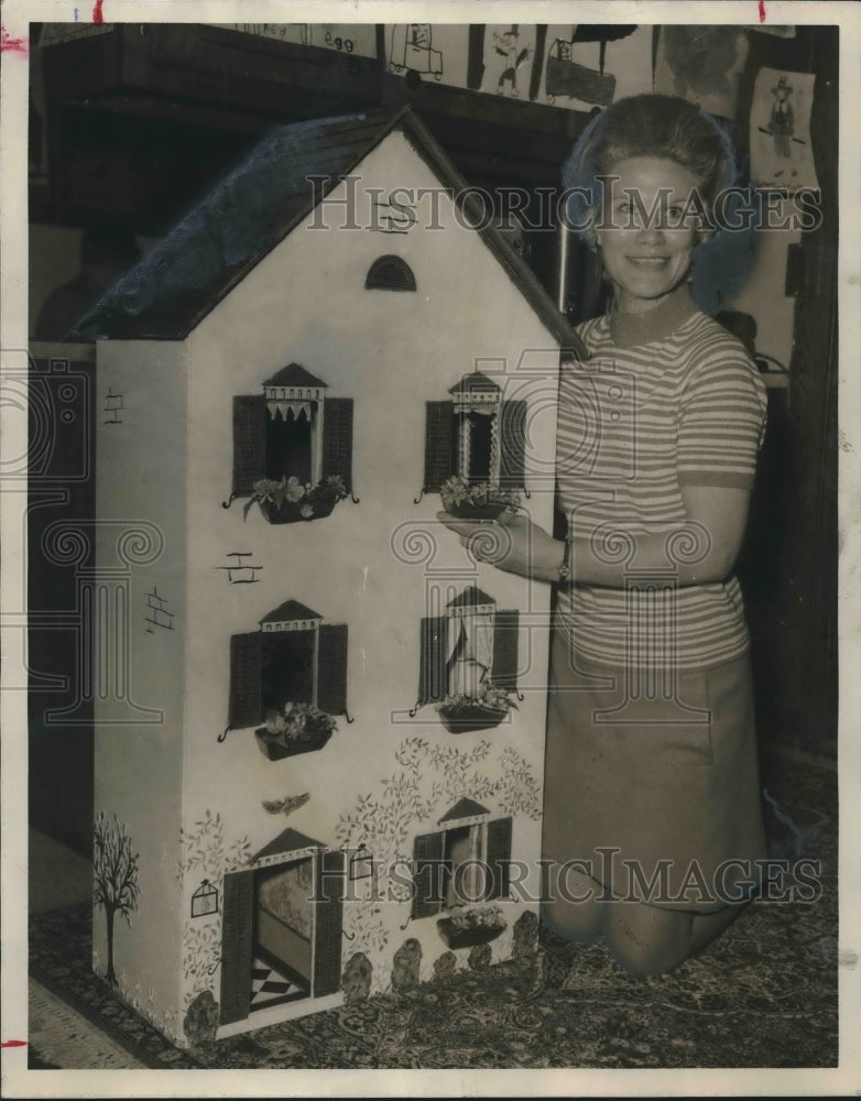 1970, Mrs. Walter Sechriest with dollhouse - abno07684 - Historic Images