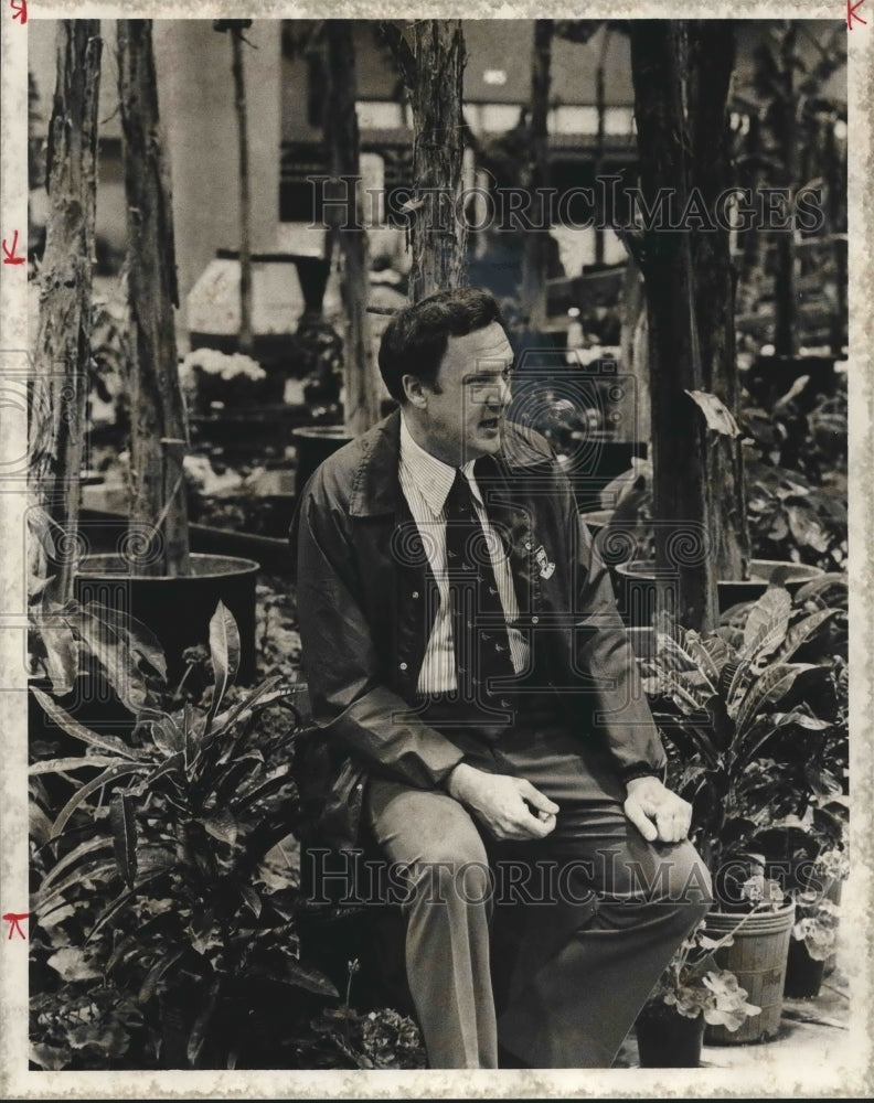 1975, International Fair coordinator Walter Sechriest with plants - Historic Images