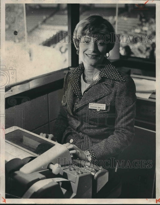 1977 Sherri Mills types messages into machine, Score Board Operator - Historic Images