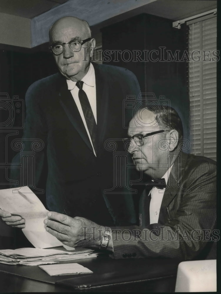 1964, Herman L. Nelson, with Ed Rodgers confer about State Highway - Historic Images