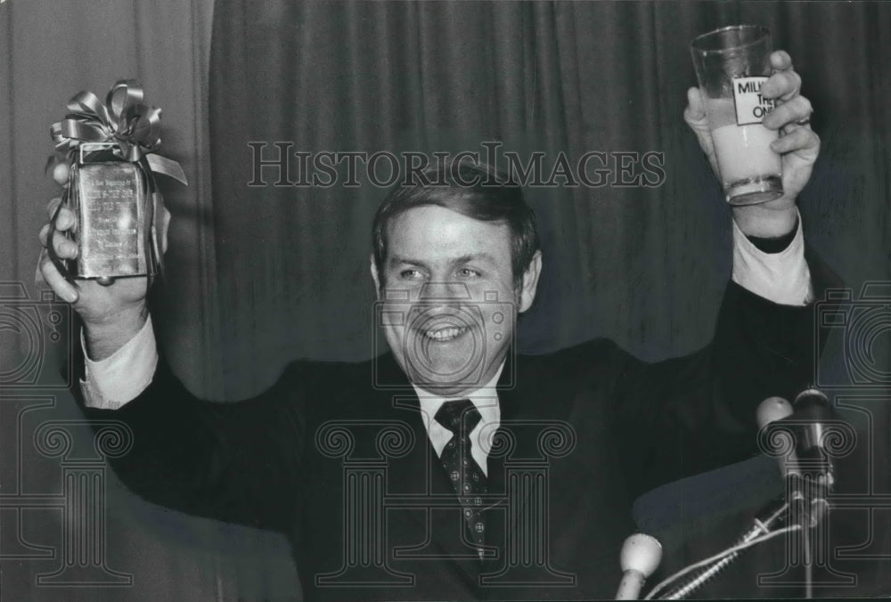 1979, Governor Fob James with cowbell and glass of milk at meeting - Historic Images