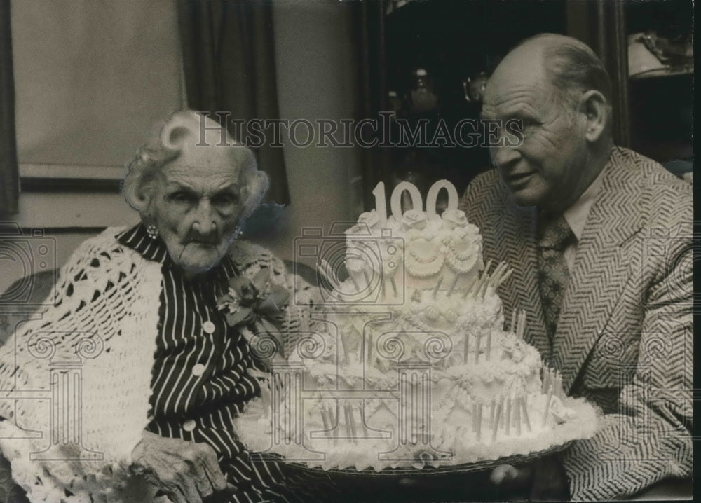 1972, Mrs. Henrietta Carnes, 100th birthday cake presented by Mayor - Historic Images