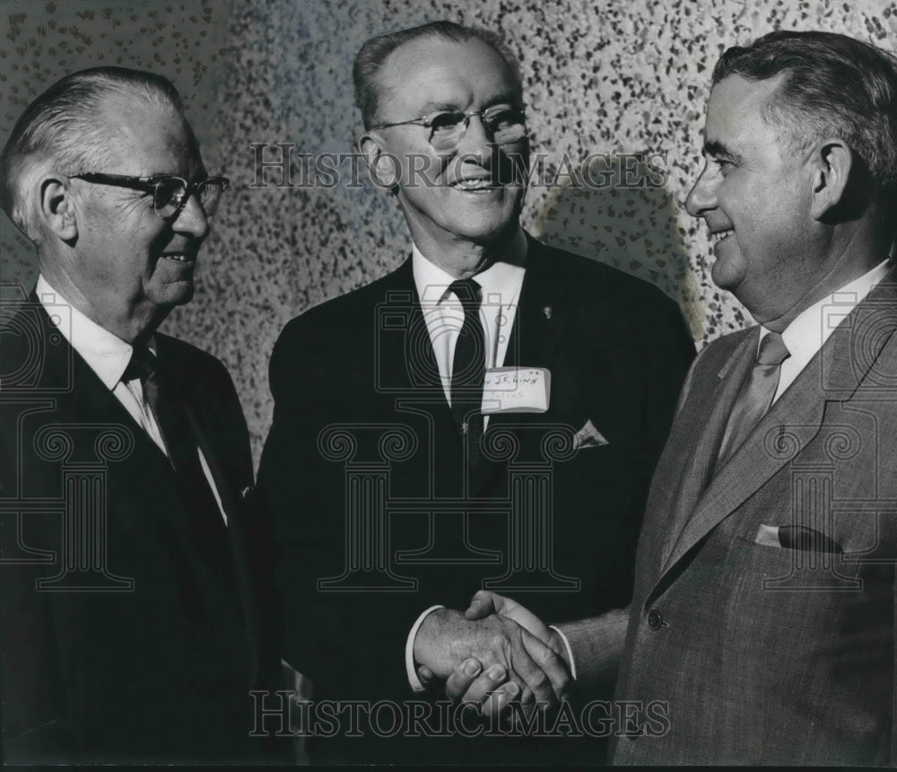 1966, Dr. Julius E. Linn, congratulates two Association Officers - Historic Images