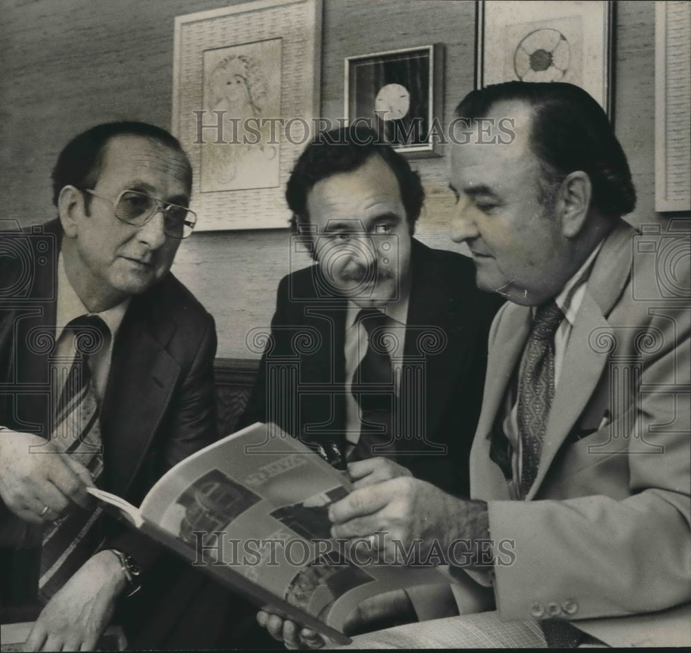 1978 Enrique de Tuya, Fernando Padron, John Marston discuss plans - Historic Images