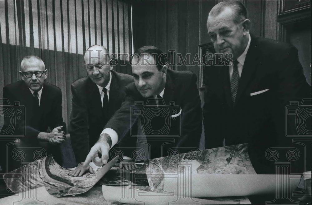 1966, Birmingham Chamber Industrial Department members discuss photos - Historic Images