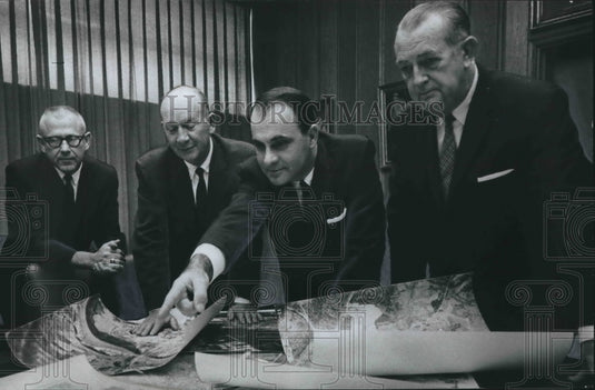 1966, Birmingham Chamber Industrial Department members discuss photos - Historic Images