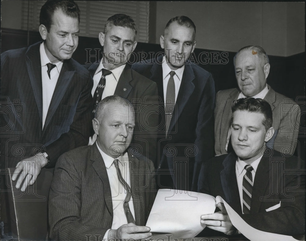 Press Photo Attorney Earl Morgan Reviews Plans - Purchase of City Park Property - Historic Images