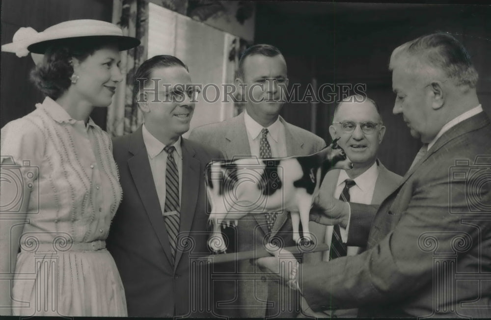 1957, Mayor James W. Morgan Holds Dairy Council Model of a Cow - Historic Images