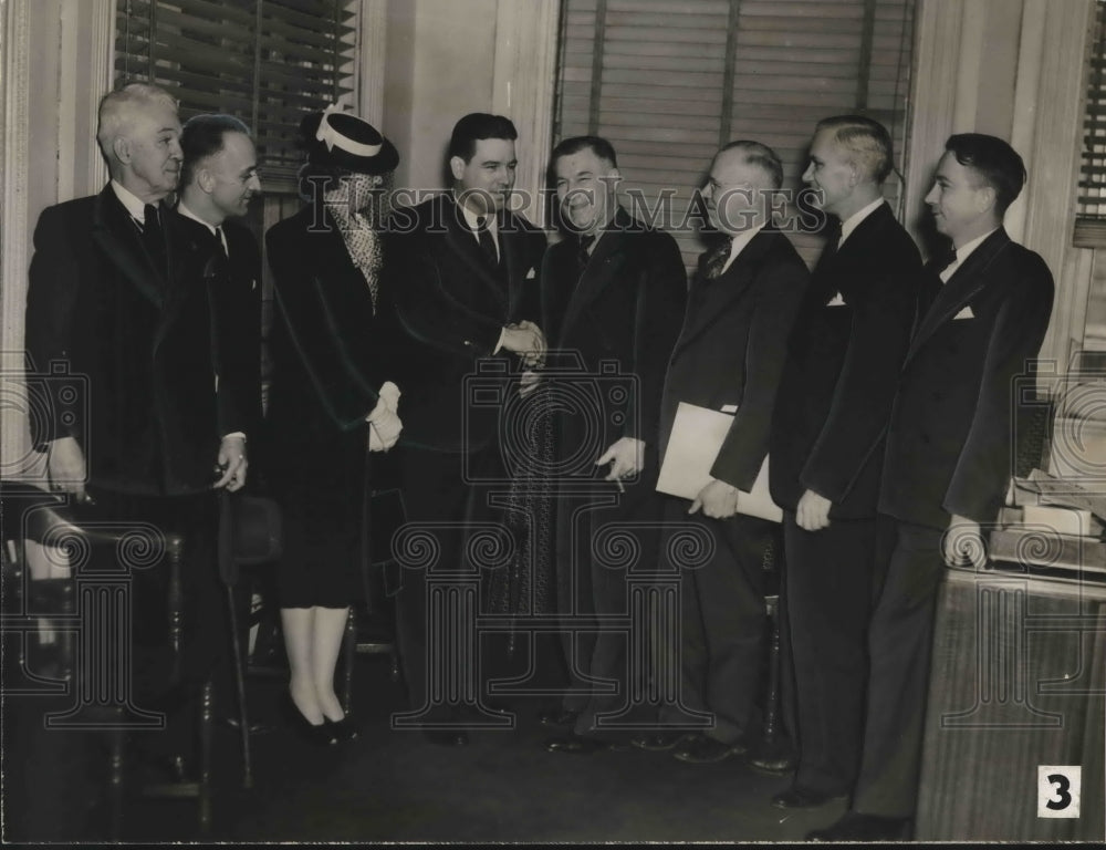 Press Photo Group in Business Attire Stands in Semi-Circle - abno08543 - Historic Images