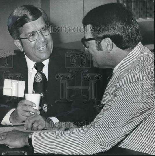 1973, L. R. Jordan and Jim Hall Compare Notes on Hospital News - Historic Images