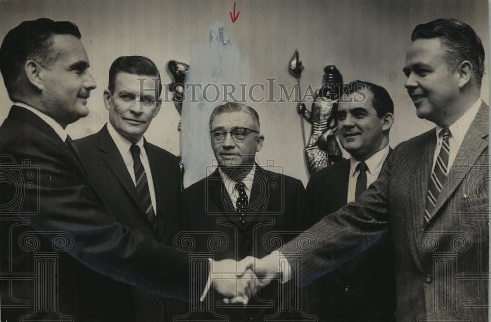 1965, Air Lines Official Greeted by Crawford T. Johnson III - Historic Images
