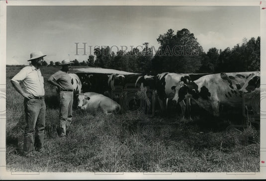1989, Charles & Ernest Whatley at Whatley Dairy Farm in Alabama - Historic Images