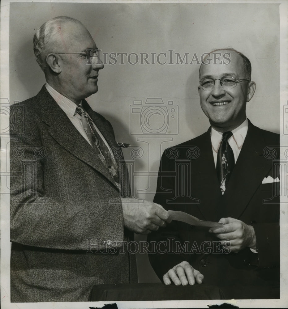 1952 Dr. Dale LeCount gives donation to Sam Hewes, Red Cross - Historic Images