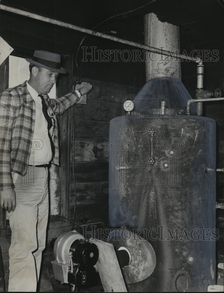 1960, Sheriff Ralph Gunn Shows "Push-Button" Moonshining - abno09422 - Historic Images